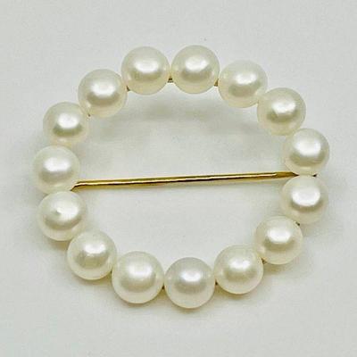 Lot 003-J: Vintage 14k Pearl Circle Pin

Features: Vintage circle pin with cultured pearls, marked 14k.

Dimensions: 1.25â€ in diameter...