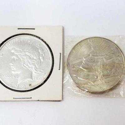 #1297 â€¢ (2) 1922 & 1934 Silver Peace Dollars
