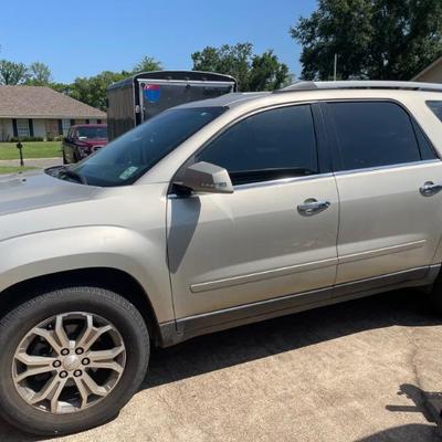 2014 GMC Acadia
140,000 miles
Small altercation with a drive-up fast food chainâ€™s menu board.