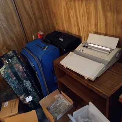 Suitcases $10 each, typewriter $30
