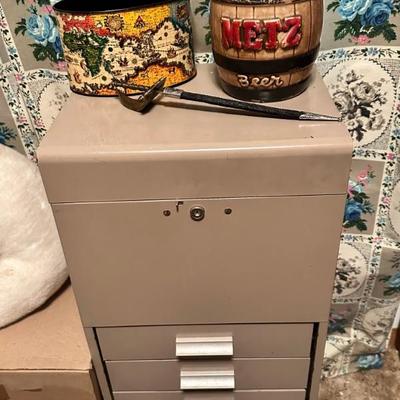 Filing cabinet with some cool items on top