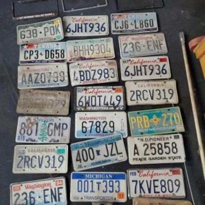 #187 â€¢ 24 License Plates and 4 Plate Frames
