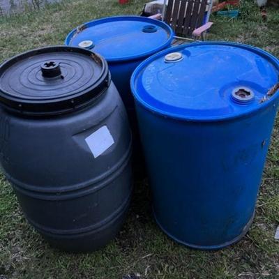 3 plastic barrels