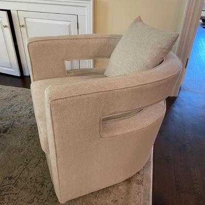 This minimalistic Kennedy Cream Swivel Chair is versatile and stylish.  29" W x 31" D x 26" H