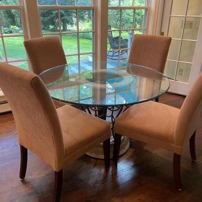 Four soft parsons chairs complete this setting