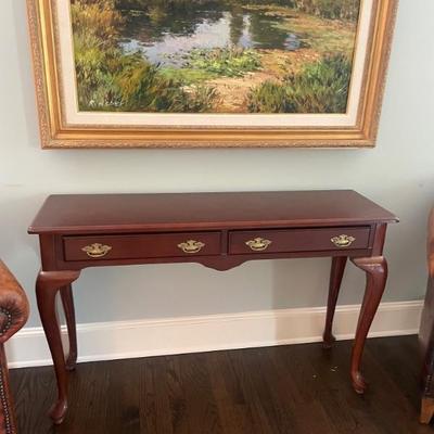 Traditional two drawer console table (leather chairs not available)