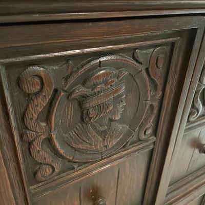 1920"s English Oak Cabinet 
Carved detail borders on door and two doors above and one door to bottom. 35" W x 17" D x...