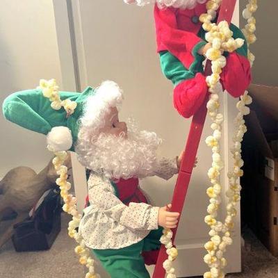 Mechanical elves on ladder