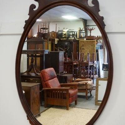 1043	MAHOGANY OVAL MIRROR, APPROXIMATELY 26 IN X 43 IN
