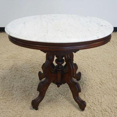 1146	WALNUT VICTORIAN OVAL MARBLE TOP PARLOR TABLE	WALNUT VICTORIAN OVAL MARBLE TOP PARLOR TABLE, APPROXIMATELY 34 IN X 25 IN X 30 IN HIGH
