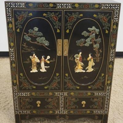 1010	20TH CENTURY ASIAN BLACK LACQUERED 2 DOOR, 2 DRAWER CABINET WITH APPLIED CARVED STONE & MOTHER OF PEARL INLAY, APPROXIMATELY 30 IN X...