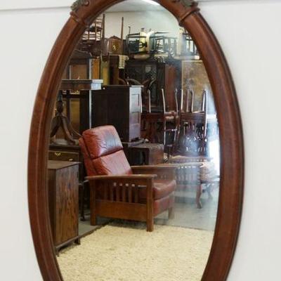 1021	MAITLAND SMITH OVAL MIRROR WITH FLOWER BASKET CARVED CREST, APPROXIMATELY 24 IN X 47 IN
