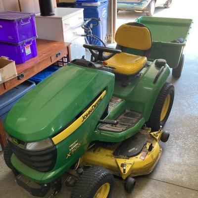 John Deere Multi Terrain X 500 mower w/ 17P dump trailer. 