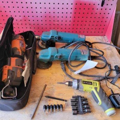 #2422 â€¢ 2 Makita Disc Grinder, Ridgid Reciprocating Saw, And 4v Ryobie Dril...
