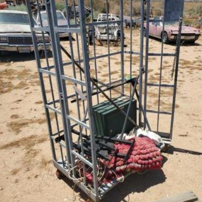 #2048 â€¢ Metal Rolling Rack with Miscellaneous Items

