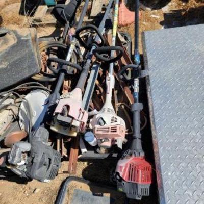 #1239 â€¢ 4 Assorted Weed Whackers
