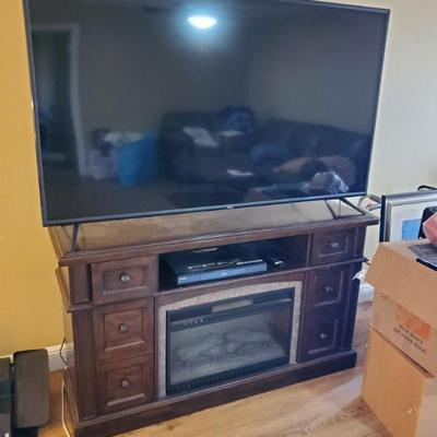 70" Vizio smart TV and fireplace console stand