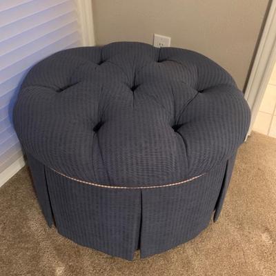 Fabric Covered Ottoman with wheels on bottom
