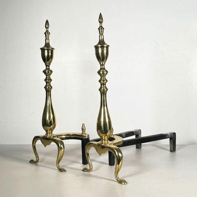 (2PC) PAIR POLISHED BRASS AND IRON ANDIRONS | Spindle polished brass with iron legs and base. - l. 17.5 x w. 7.5 x h. 20 in 