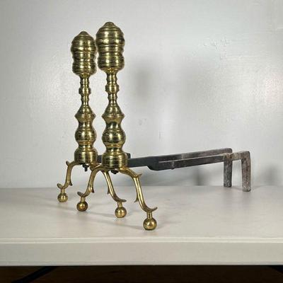 (2PC) PAIR IRON AND BRASS ANDIRONS | Round spindle polished brass with branch-like legs and cast iron back leg. - l. 21 x w. 11.5 x h....