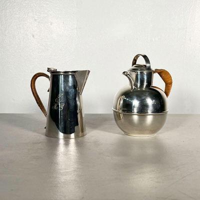 (2PC) PAIR SILVER PLATED RATTAN PITCHERS | Includes pair of silver plate pitchers with rattan handles. - h. 6 x dia. 4.5 in (larger) 