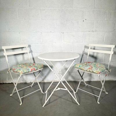 WHITE OUTDOOR BISTRO SET | Includes: 2 folding metal chairs with cushions and round metal folding table. 20in seat height. - h. 28.5 x...