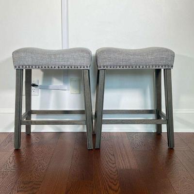 (2PC) PAIR UPHOLSTERED BARSTOOLS | Gray upholstery on stained grayish wood bases. - l. 20.25 x w. 14 x h. 26 in 