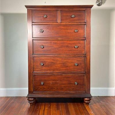 TALL WOOD DRESSER | Dark wood dresser with double drawers over four graduated full-width drawers. - l. 40 x w. 19 x h. 60.25 in 