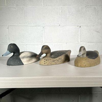 (3PC) WILDFOWLER DECOYS INC | Paint decorated wooden duck decoys, with impressed stamp marks on the bottom, including: Bluebill duck,...