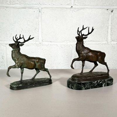 (2PC) AFTER ANTOINE-LOUIS BARYE (1795-1875) | Stag with head raised. Identical castings, one figurine on a stone plinth. - l. 7.5 x w....
