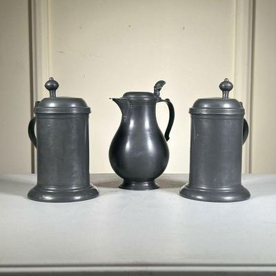 (3pc) Pewter Flagon & Tankards | Lot Includes: (2) Pair of Tankards both with unknown touch mark by handle. Great patina. (1) French...