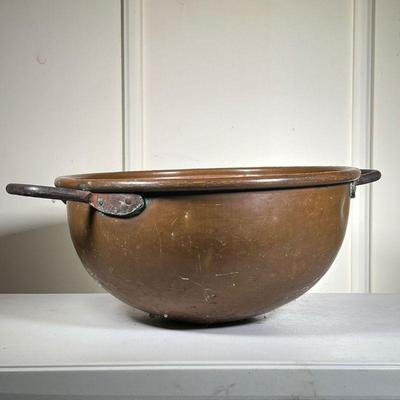 Large Copper Kettle | Early American apple butter copper kettle with iron handles. - h. 10 x dia. 21.5 in (Dia excludes handles) 