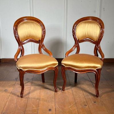 (2pc) Pair Walnut Finger Carved Chairs | Finger carved walnut chairs with a rounded back and legs, and gold cushion. - l. 24 x w. 19 x h....