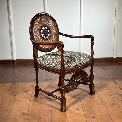 Medallion Back Armchair | Vintage unusual carved circle-back with cane insert. Scroll carving throughout, ending in Spanish front feet. -...