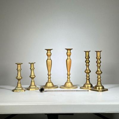 (7pc) Brass Candlesticks | Three pairs of brass candlesticks and a brass snuffer. - h. 11 in (taller candlestick pair) 