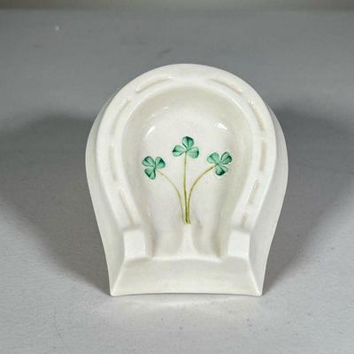 Lucky Belleek Ashtray | Ceramic ashtray shaped like a horseshoe with green clover motif. - l. 3 x w. 4.5 in 