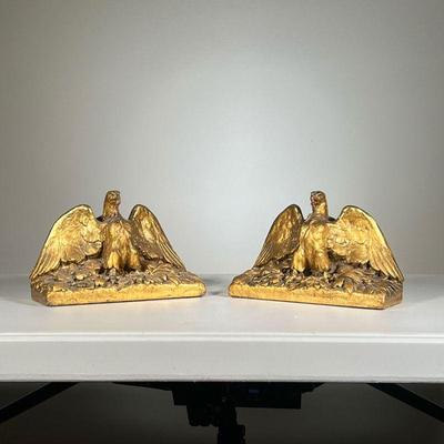 Pair Eagle Bookends | Gilt carved wood eagle bookends with federal shield backs. - l. 9 x w. 3.5 x h. 6 in 