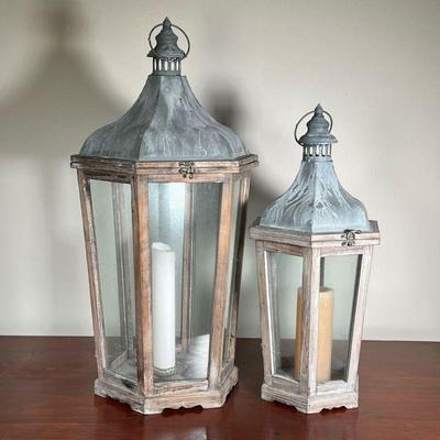 (2pc) Wood Lanterns | Including a large decorative wood lantern with glass panels and a matching lantern of smaller size. - l. 16 x w. 14...