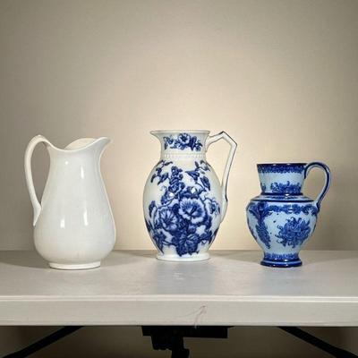 (3pc) Blue & White Jugs | Lot of three large pitchers: one blue and white W H Grindley Co. Osborne jug; one blue floral hand painted...