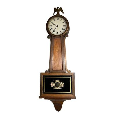 Banjo Clock | Banjo clock with a natural wood finish, eagle finial, reverse painted Ã©glomisÃ© tablet, wood throat, dial door with glass...
