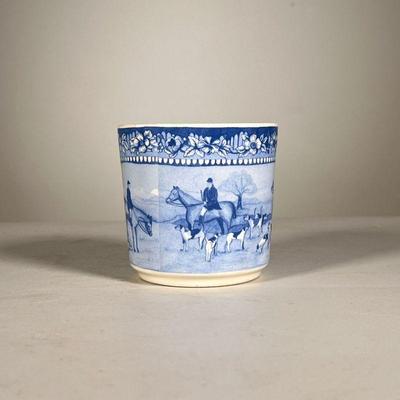 Ralph Lauren Cup | A small blue and white cup by Ralph Lauren featuring men on horseback and dogs preparing for a fox hunt. - h. 3.25 x...