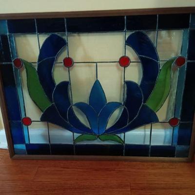 Beautiful handmade stained glass in frame with hooks to hang.