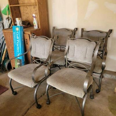 Set of four padded chairs with wheels