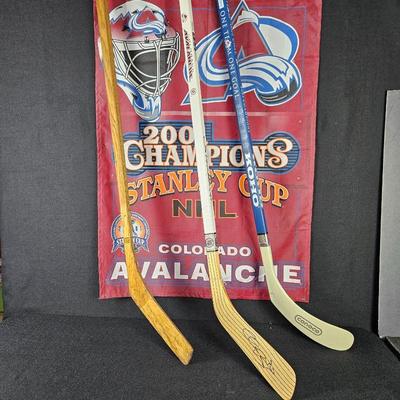 Three hockey sticks and Avalanche flag 28
