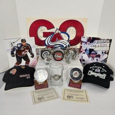 Set of Colorado Avalanche Hockey Items- 2 Signed Pucks Crawford & Hejduk, Hats, Signed Plaque, Mug & More