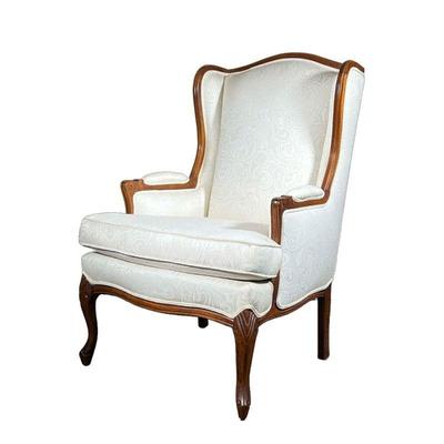 OFF WHITE WING BACK ARMCHAIR | Wing back armchair with carved arms and legs and off white cushion. - l. 29 x w. 24 x h. 42 in 