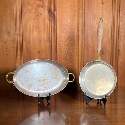 (2PC) COPPER COOKWARE | Includes; copper frying pan with brass and turned wood handle; and large oval copper pan with brass handles. - l....