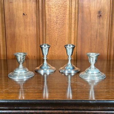 (4PC) 2 PAIR STERLING SILVER CANDLESTICKS | 2 pair of Sterling silver candlesticks stamped â€œFisher Sterlingâ€ on bottom. - h. 5 x dia....