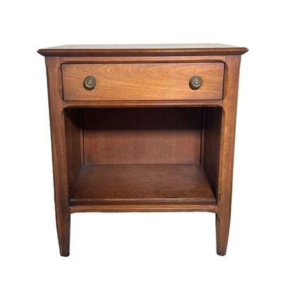 MID CENTURY WOODEN BEDSIDE TABLE | Carved wood side table with drawer, round brass pulls, and shelf beneath. - l. 22 x w. 16 x h. 25 in 