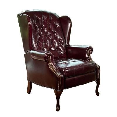 LEATHER RECLINER | Wing back leather recliner with tufted back and tack border on arms. Seat height; 18in. - l. 64 x w. 30.5 x h. 42 in...
